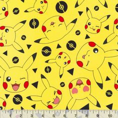 a yellow background with pikachu and other pokemon characters on it, as well as a ruler