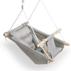 a baby swing that is attached to the back of a chair with two wooden handles