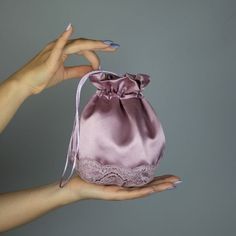 A very elegant satin taft bag for your wedding party or evening dress. Made of luxury satin taft. Color: mauve Bag is approx. 18 x 18 cm , ideal to keep a lipstick, telephone etc. WE have matching wraps in our Etsy Shop! WE accept credit cards! Elegant Satin Evening Bag With Satin Finish, Elegant Satin Pouch Evening Bag, Elegant Satin Pouch Bag, Elegant Purple Bag Gift, Elegant Lavender Formal Bag, Elegant Satin Wedding Bag, Elegant Bag With Satin Lining For Gift, Elegant Bag With Satin Lining As Gift, Satin Pouch Bag For Gift