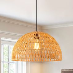 a light hanging over a dining room table