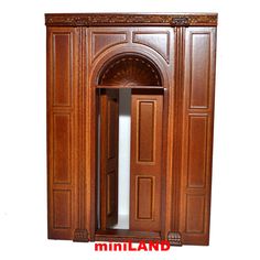 an old fashioned wooden cabinet with a door and window on the front, side view