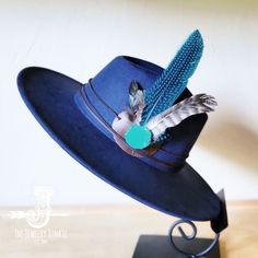 If you’re looking for the perfect accessory to complement your favorite boho style, look no further. This Boho-Style Western Felt Hat w/ Natural Feather & Turquoise Hat Accent by The Jewelry Junkie is absolutely everything that you need. Not only is it easy to incorporate into any and all outfits, but the genuine leather and natural feathers of the band immediately elevate whatever it is you’re wearing. One Size Hat with adjustable inner hat liner (see last photos) The same primary feathers will Turquoise Hat, Western Hat, Leather Hat, Medium Handbags, Packing Jewelry, Western Hats, Leather Hats, Large Handbags, Handbag Straps