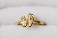 18k Solid Gold Plated 925 Sterling Silver Ring * Baby Hand & Footprint Ring * Family Heirloom Ring * New Mom Gift  💗 Personalize your experience with your baby's hand and footprints, embracing the joy of parenthood through our exquisite design💗  ORDERING INSTRUCTIONS *  Simply send your baby's hand and foot pictures via Etsy Messenger. *  Use the 'Personalization Box' to specify any additional engraving requests. We will accommodate them to the best of our ability. ATTENTION TO DETAILS *  This 3mm / 3.5mm wide band is crafted from 925 sterling silver with 18k gold plated using our high-fidelity carving technique, ensuring you never have to compromise on luxury. QUICK TURNAROUND *  We understand how important it is for you to receive your custom jewelry quickly. That's why we ensure the f Family Heirloom Ring, Heirloom Ring, Heirloom Rings, Baby Footprint, Baby Rings, Heirloom Gifts, Gold Jewelry Stores, Baby Hands, High Fidelity