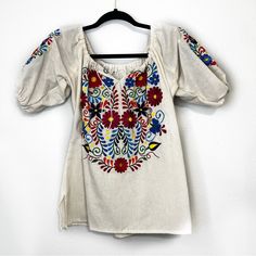 Mexican Embroidered Floral Blouse. Size M. Cream With Colorful Embroidered Flowers. Flat Measurement Of Length Is 23” And Armpit To Armpit Is 19”. Nwot (E723149) Summer Tops With Multicolor Embroidered Sleeves, Summer Tops With Multicolor Embroidery And Embroidered Sleeves, Spring Festive Embroidered Short Sleeve Top, Festive Spring Embroidered Top With Short Sleeves, Festive Embroidered Short Sleeve Top For Spring, Fitted Embroidered Short Sleeve Top, Fitted Embroidered Top With Short Sleeves, Summer Festive Embroidered Blouse, Summer Festive Blouse With Floral Embroidery