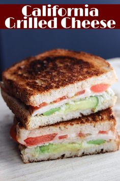 two grilled sandwiches stacked on top of each other with the words california grilled cheese