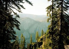 the mountains are surrounded by trees and rocks