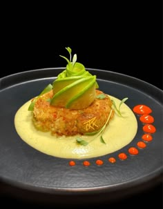 a plate with some food on it and garnished with green leafy vegetables