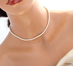 "This timeless dainty necklace has lustrous Austrian pearls in white.  Dainty pearls measure 4 mm in diameter.  This necklace can be dressed up or down.  Perfect for those of you looking to wear a classic look!  This is an everyday wear pearl necklace. Perfect for a classy bride or any special occasion!  Necklace is available from bold to dainty please choose pearls size at checkout!   Makes a perfect gift for bridesmaid, maid of honor, mother of the bride, mother of the groom, mother's day, prom gift, gifts for her, anniversary gift. Pearls measure 4 mm in diameter.   Standard length is 16\" long with 2\" extender chain.  Finished with spring ring clasp or lobster claw closure. Available in three finishes, silver, gold and rose gold. Pearls are available in different shades, please see co Elegant Single Strand White Choker, Elegant White Single Strand Choker, Classic Pearl White Wedding Choker, Dainty Round Bead Pearl Necklace For Wedding, Dainty Pearl Necklace With Round Beads For Wedding, Delicate Pearl Pendant Choker For Wedding, Dainty Pearl Wedding Necklace With Round Beads, Dainty Round Pearl Wedding Necklace, Classic Pearl Choker For Wedding