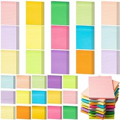 a stack of colorful sticky notes on top of each other next to a pile of papers