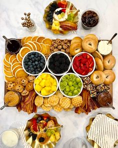 a platter filled with lots of different types of snacks and desserts on plates