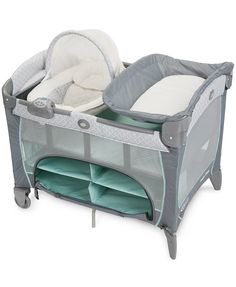 a baby crib with an infant's bed and changing table in the middle