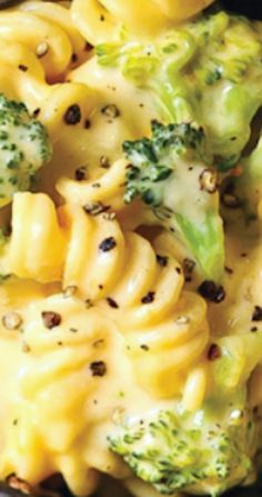 broccoli and cheese pasta in a black bowl