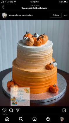 a three tiered cake with pumpkins on top is shown in the instagram