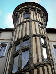 an old building with wooden balconies and windows