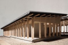 a model of a building made out of wood