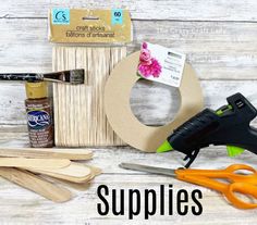 supplies needed for crafting on a white wooden background with text overlay that says supplies