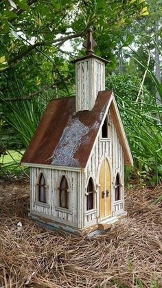 a small white church with a brown roof