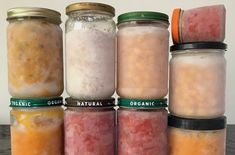 several jars filled with different types of food