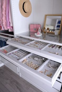 a closet filled with lots of different types of jewelry