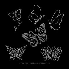 three butterflies flying in the air on a black background