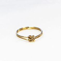 This love knot ring is dainty and filled with love. Wear a single ring for a minimal look or stack with a favorite band. -High quality 14kt gold filled - not plated -Love knot design in the center -Water Friendly Infinity Knot Ring, Knot Jewelry, Ring Inspo, Love Knot Ring, Infinity Knot, Jewel Wedding, Single Ring, Jewelry Knots, Black Beaded Jewelry