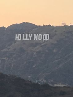 the hollywood sign is on top of a mountain