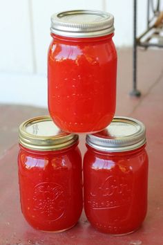 three jars are stacked on top of each other