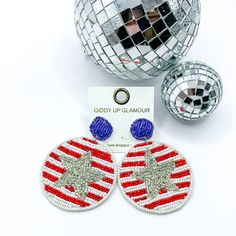 USA Strong Beaded Circle Drop Earrings with Silver Center Star, pitured with silver disco balls on a white background. Trendy Beaded Earrings For Party, Trendy Summer Beaded Earrings, Star Shaped Summer Party Earrings, Multicolor Large Beaded Round Earrings, Handmade Red Beaded Earrings For 4th Of July, Patriotic Silver Dangle Earrings, Multicolor Star-shaped Party Earrings, Beaded Circle, Patriotic Red Star-shaped Earrings