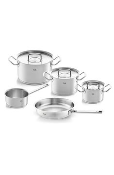 an assortment of pots and pans on a white background