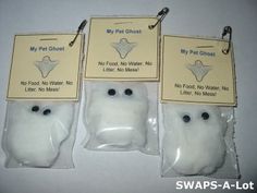 three bags of fake ghost with tags attached to the front and back of each bag