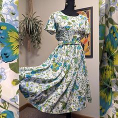 Fabric: woven polyester (no stretch) This 1950s-early 60s dress features the most gorgeous hydrangea and butterfly print in addition to ruching, dolman style sleeves, a full skirt, and a matching belt. The bodice of this dress is lined.  *CONDITION: Excellent condition. No major flaws found upon inspection, only one small mark as shown.  This item will best fit a size 6 or Small, but PLEASE see the measurements below for the most accurate representation of size.  **MEASUREMENTS (taken laying fla Mid-century Floral Print Dress For Spring, Mid-century Floral Print Spring Dress, 1950s Style Spring Dresses With Vintage Pattern, Spring 1950s Style Dresses With Vintage Pattern, Spring 1950s Vintage Pattern Dresses, Franklin Nc, Circle Skirt Dress, Dress With Ruching, Summer Day Dresses