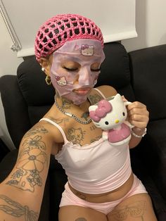 a woman with hello kitty on her face