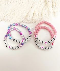 Price includes 1 bracelet. Please choose style & size  in drop down list.  Available styles: -Mixed colour bead + LIL SIS in black letter white bead -mixed colour bead + big sis in black letter white bead  -pink beads + lil sis in black letter white bead -pink beads + big sis in black letter white bead -customize (please message seller directly prior to making purchase to customize) **please note: this will be shipped via Canada post regular letter mail without tracking. If you would like to rec Big Sister Bracelet, Bracelet Party, Sister Bracelet, Lil Sis, Bracelet Bead, Bracelet Friendship, Big Sis, Matching Jewelry, Beaded Bracelets Diy