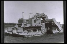 an old black and white photo of a bulldozer