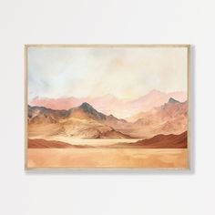 a painting hanging on the wall with mountains in the background