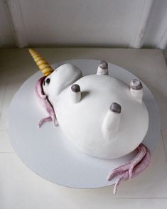 there is a cake that looks like an animal with a horn on it