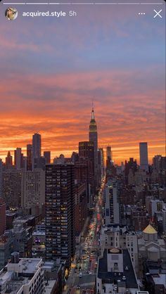 the city skyline is lit up at sunset