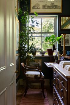 a room filled with lots of furniture and plants on top of a window sill