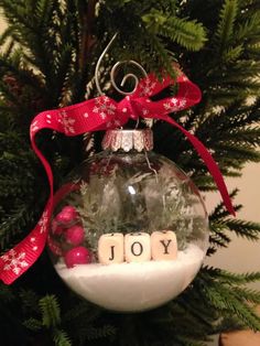 a christmas ornament with the word joy in it