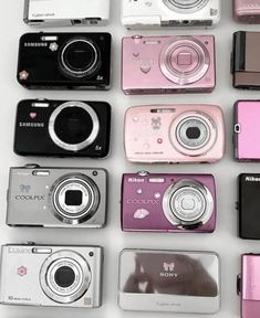 many different types of digital cameras sitting next to each other