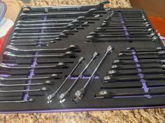 there are many wrenches in the tray on the counter top and one is empty