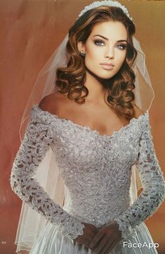 an old photo of a woman wearing a wedding dress and holding her hands on her hips