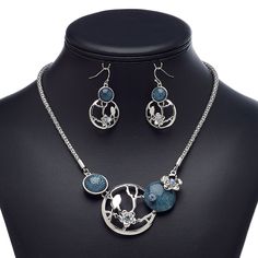 This ready-to-wear necklace featuring glass rhinestones and matching earrings is ideal for gift-giving, counter sales or extending current jewelry lines. Earnuts included. Colors, shapes and sizes may vary in each lot. Blue Alloy Earrings For Gift, Elegant Blue Alloy Jewelry Sets, Silver Jewelry Sets With Rhinestones, Blue Metal Earrings With Rhinestones, Blue Rhinestone Round Jewelry, Nickel-free Gray Metal Jewelry, Nickel-free Silver Alloy Jewelry Sets, Blue Rhinestone Jewelry Sets For Gift, Blue Metal Jewelry Sets