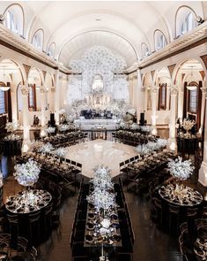 an elaborately decorated banquet hall with tables and chairs