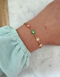 Beautiful multi-colored flower bracelet with a 14k gold filled clasp and jumprings. Can be made in an adult size or child length with extender. Child length is made with an extender to be approximately 5.25"-6.5". Giftbox included. Colorful Flower Shaped Jewelry For Gifts, Colorful Flower Shaped Jewelry Gift, Colorful Flower-shaped Jewelry For Gifts, Dainty Multicolor Flower Jewelry, Colorful Flower-shaped Jewelry Gift, Colorful Flower Bracelets As Gift, Colorful Flower Bracelets For Gifts, Colorful Flower-shaped Bracelets For Gifts, Multicolor Dainty Jewelry With Flower Charm