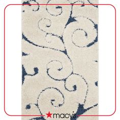 a white rug with blue swirls on it