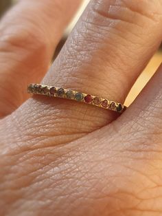 This is a 14 karat gold ring set with natural colorful saphires. The multy colors saphires are set all around. A simple yet elegant ring with colorful saphires. A dainty classic eternity band with color saphires, that will suit as a wedding, anniversary, or a gift for yourseif. -2 mm width ring -1.4 mm saphires set all around. -14 karat gold ring -Free shipping -All my jewelry are sent in a gift box Please note that you may be charged taxes by your country's customs, please check this before you Promise Yellow Gold Multi-stone Sapphire Ring, Promise Multi-stone Sapphire Ring In Yellow Gold, Yellow Gold Multi-stone Sapphire Promise Ring, 14k Gold Multi-stone Eternity Band, Gold Half Eternity Sapphire Ring, Multi-stone 14k Gold Eternity Band For Anniversary, 14k Gold Multi-stone Eternity Band For Anniversary, Gold Sapphire Half Eternity Ring, Gold Sapphire Ring With Half Eternity Design