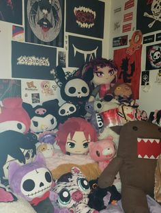 a pile of stuffed animals sitting on top of a bed in a room filled with posters