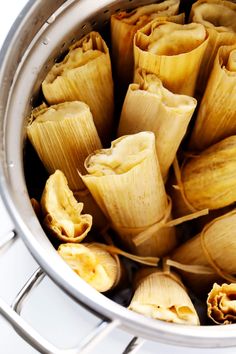 some dumplings are in a pot on the stove and ready to be cooked for dinner