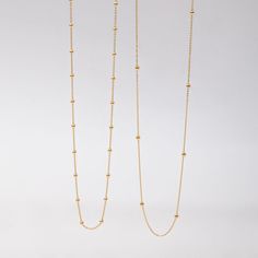 🌟 Elevate your style with our 14k solid gold satellite beaded ball chain necklace. This delicate and minimalist necklace features evenly spaced gold beads, making it perfect for layering or wearing alone. Ideal for everyday wear and special occasions, this timeless piece adds a touch of sophistication to any outfit. Perfect for birthdays, anniversaries, or just because. ✨ Perfect For:     Birthdays 🎉     Anniversaries 💕     Everyday Elegance 🌼 Order now to add a versatile and elegant piece t Minimalist Tiny Beads Chain Necklace For Everyday, Minimalist Yellow Gold Ball Chain Necklace, Minimalist Yellow Gold Chain Necklace With Ball Chain, Minimalist Yellow Gold Beaded Necklace With Delicate Chain, Everyday Minimalist Ball Chain Necklace, Minimalist Ball Chain Necklace With Round Beads, Minimalist Ball Chain Necklace, Everyday Minimalist Beaded Necklace With Delicate Chain, Minimalist Necklace With Ball Chain And Round Beads